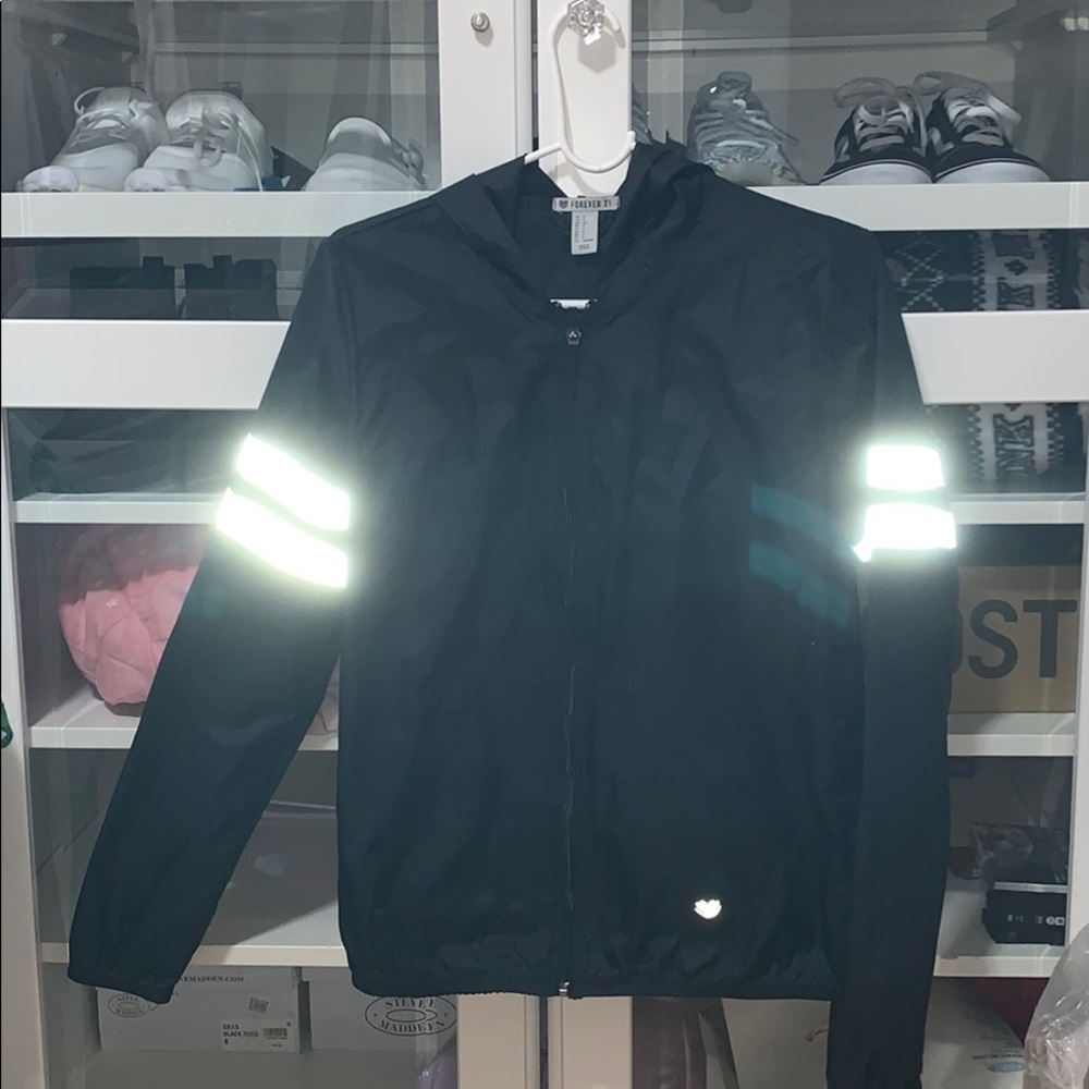 Navy blue and silver wind breaker